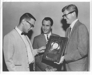 Johnny Rowe (John Rook) receiving his first gold record for Ralf Harris' "Tie Me Kangaroo Down Sport" at KTLN, Denver. (1963)